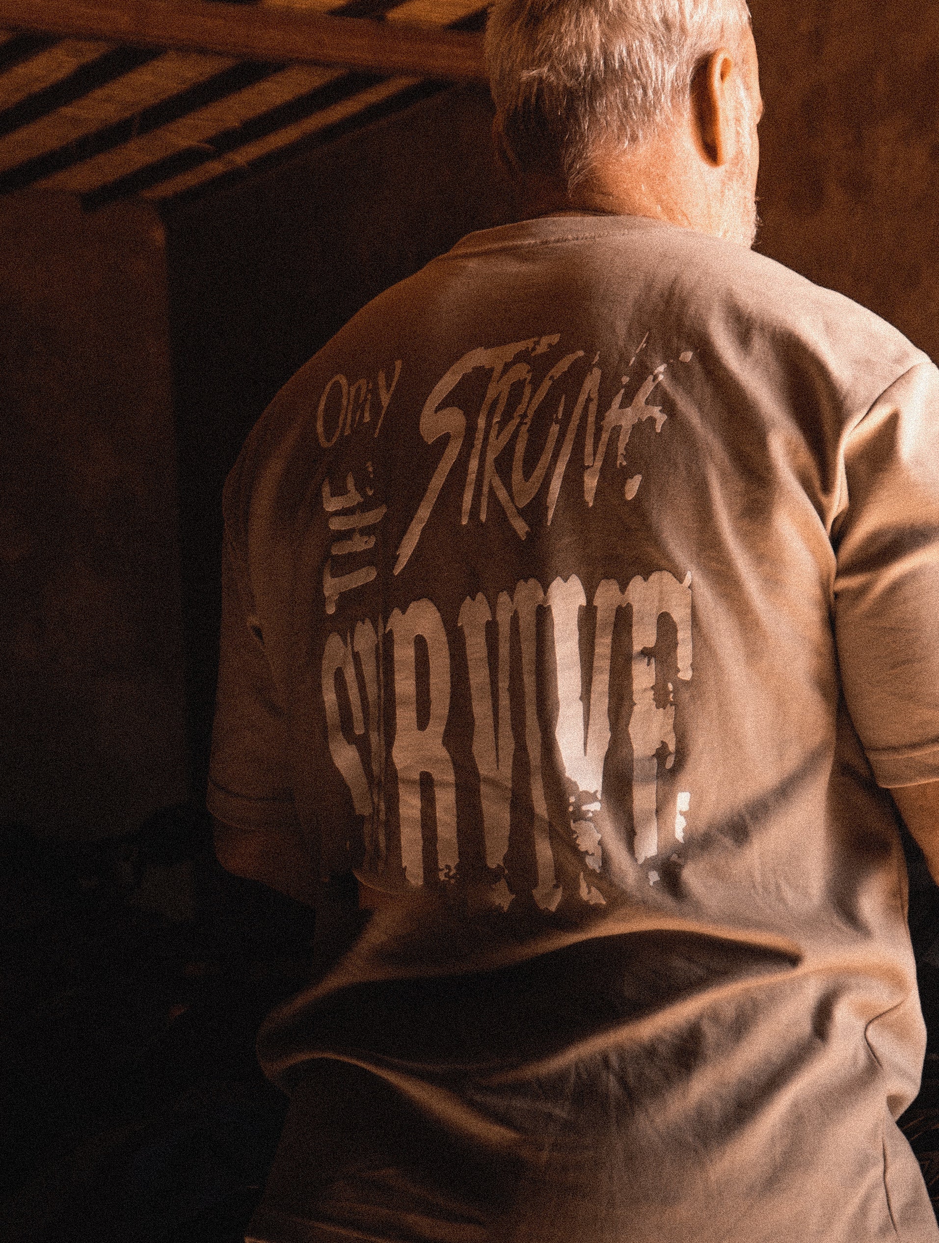 "Only the strong survive" tee